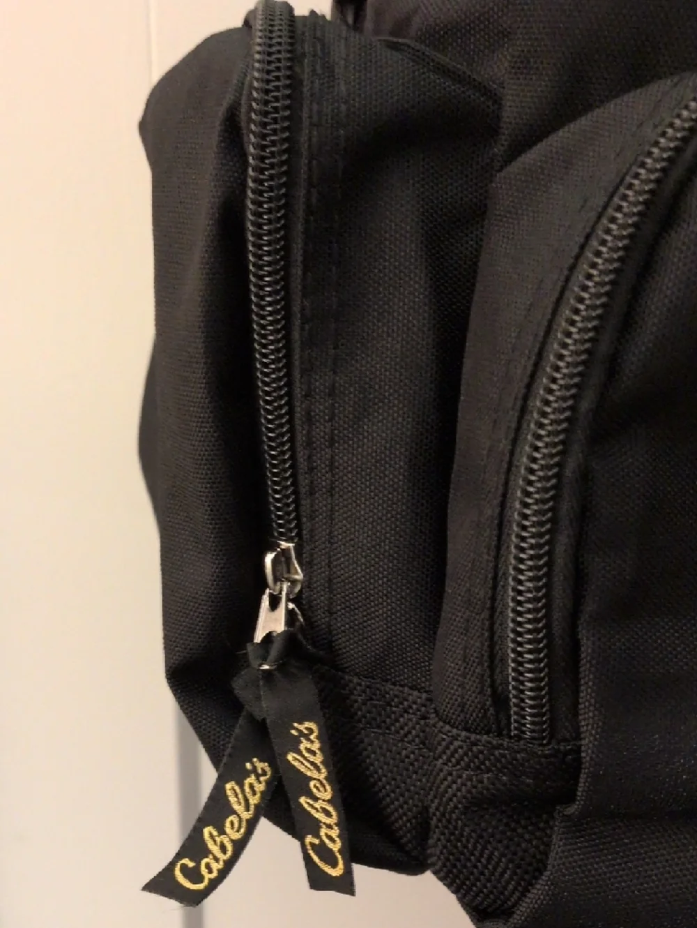 Cabela's Black Duffel Bag with Gold Logo and Adjustable Strap